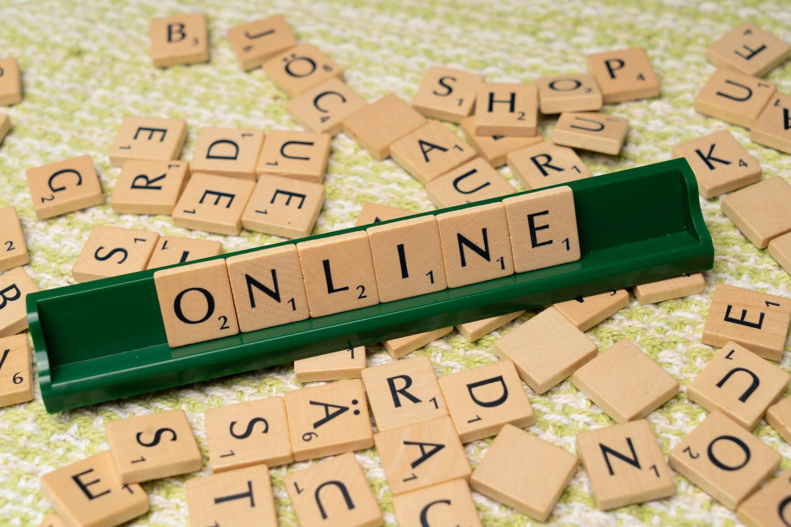 The word online is spelled out with scrabble tiles